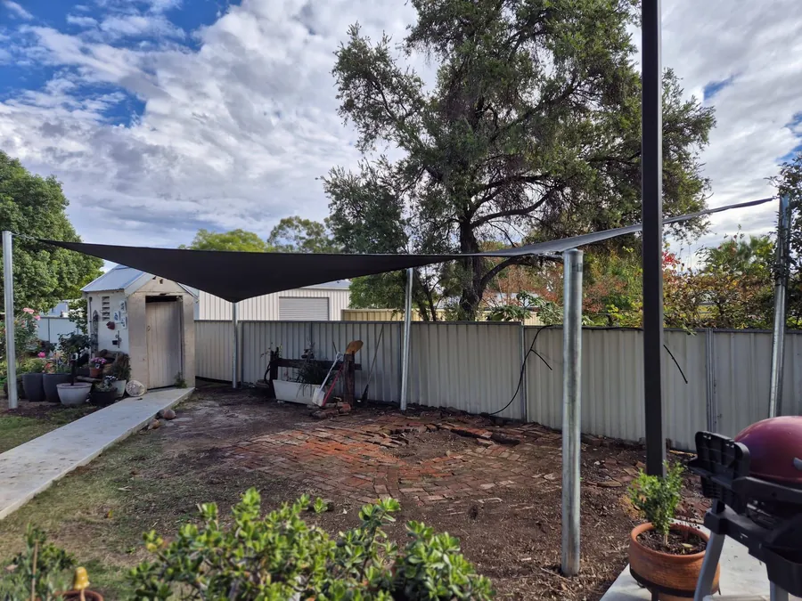 Charcoal shade sail on steel posts over a new backyard - New England Shade Sails, Tamworth