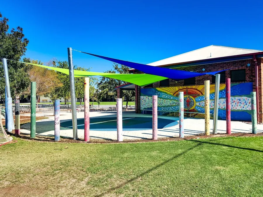 Colourful shade sails over a school pool and play area - New England Shade Sails, Tamworth