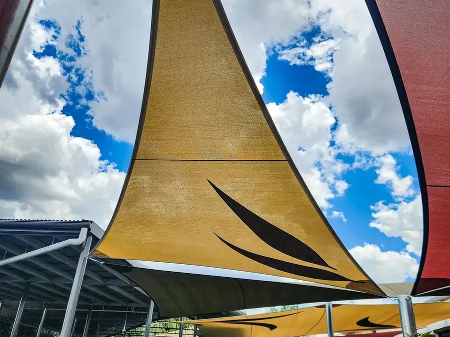 Close view of a sand-coloured shade sail with a custom fabric cut-out - New England Shade Sails, Tamworth