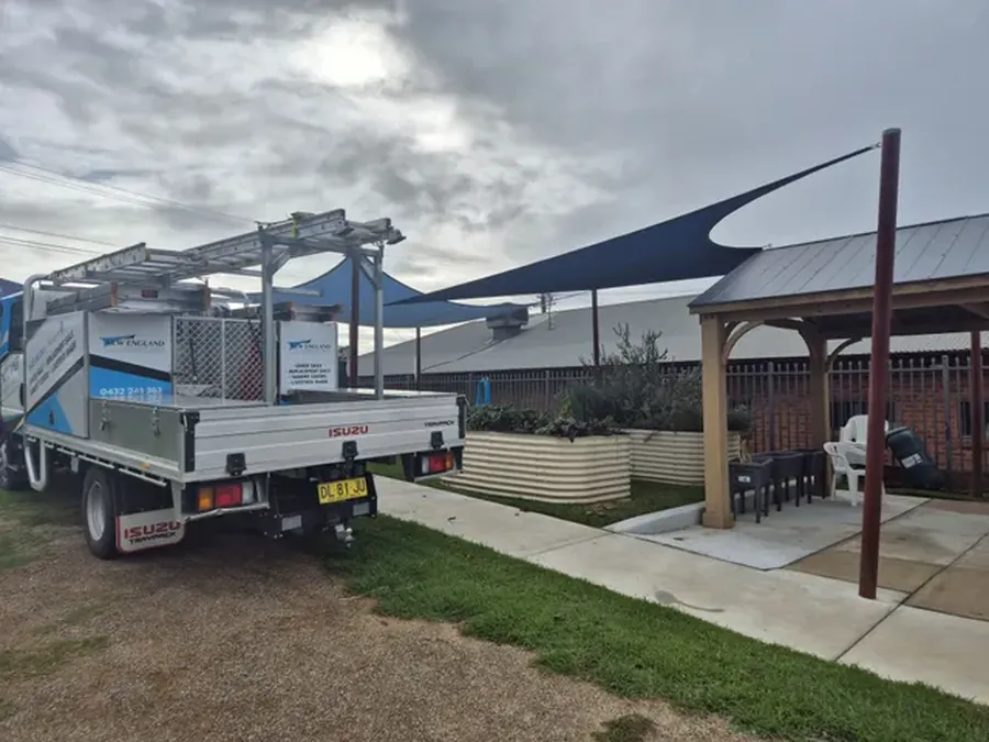 Shade sail installed beside a commercial car park and covered seating - New England Shade Sails, Tamworth