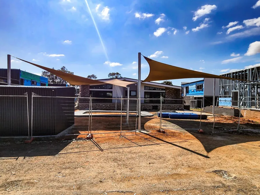 Shade sail installation in progress with posts set and fabric being tensioned - New England Shade Sails, Tamworth