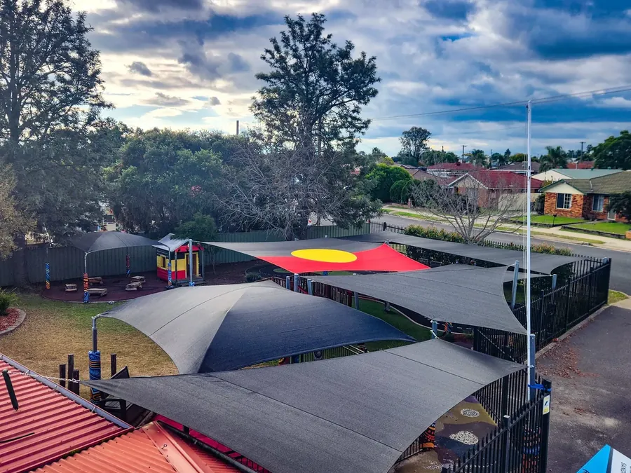 Dark shade sails covering outdoor areas across a school campus - New England Shade Sails, Tamworth