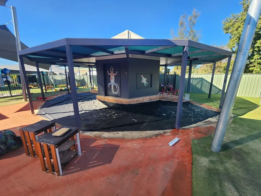 Shade structure covering play equipment and seating at a Tamworth playground - New England Shade Sails, Tamworth