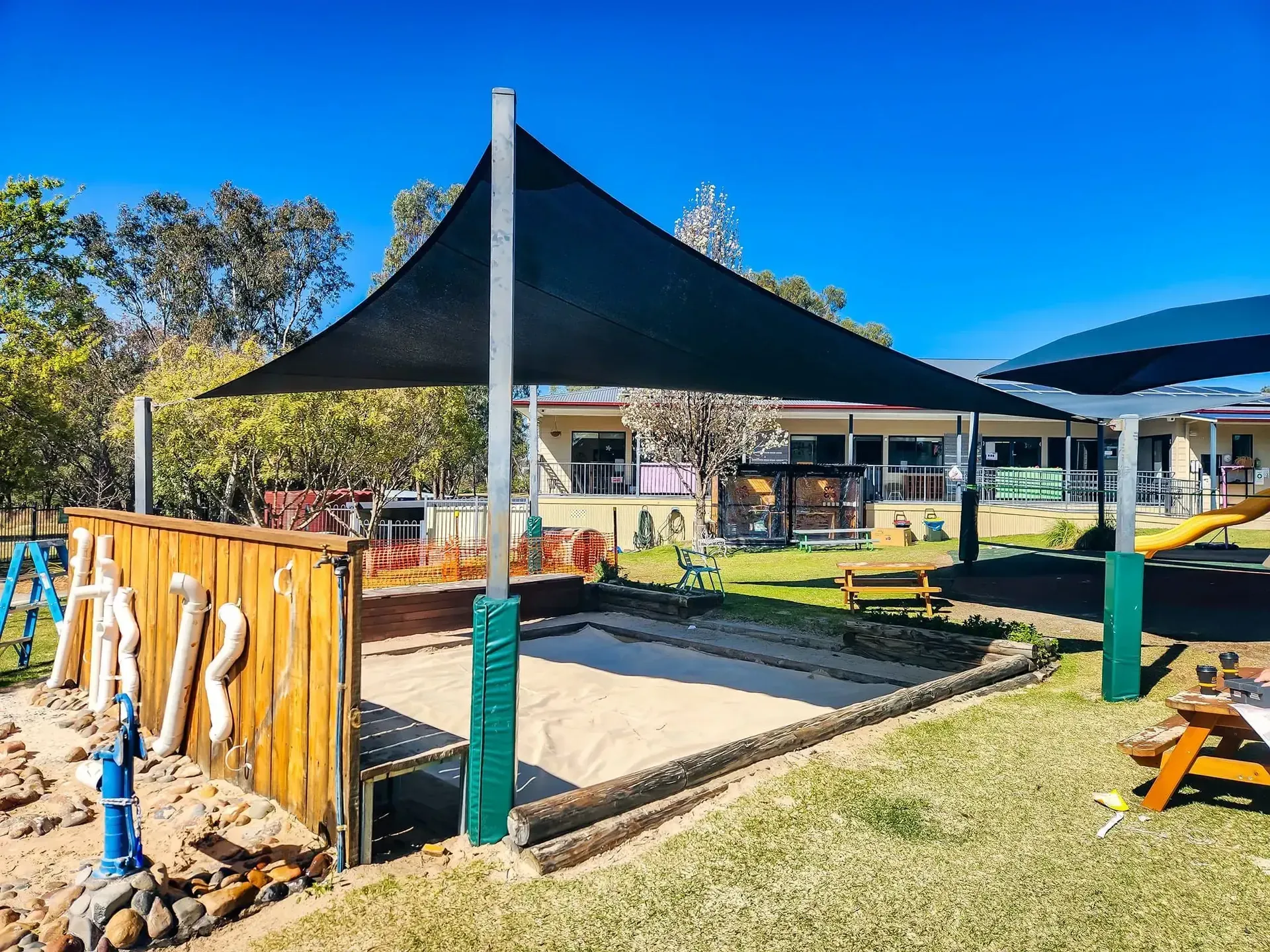 Charcoal shade sails over an outdoor play and seating area at a school in Quirindi - New England Shade Sails, Tamworth